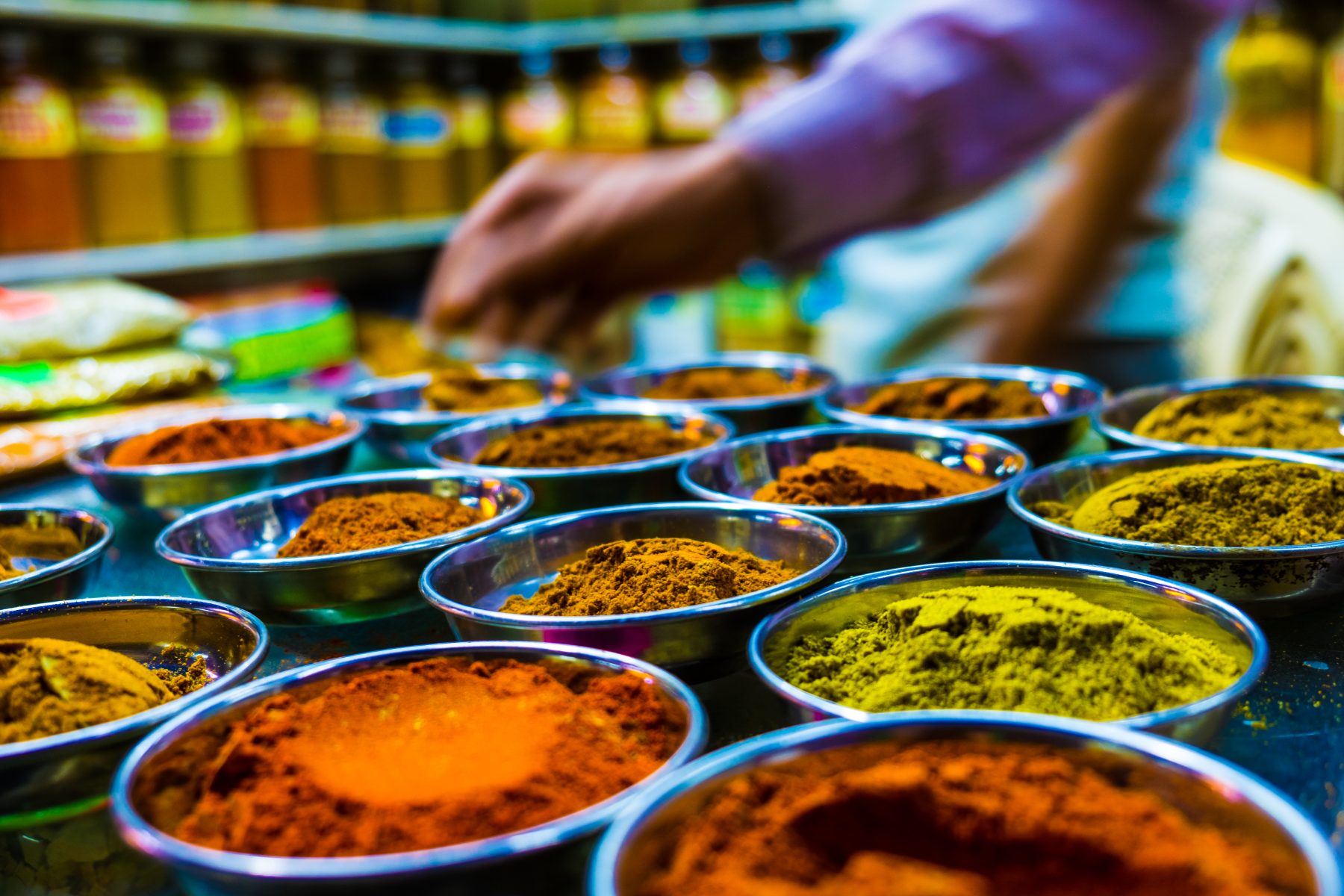 A spice market in Bombay — real people, real decisions