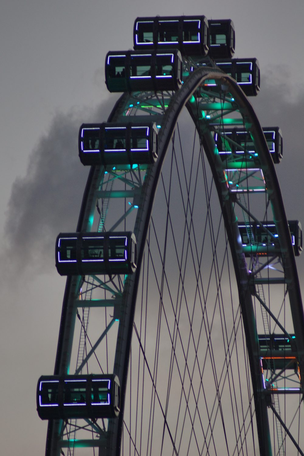 Observation wheel against a grey sky