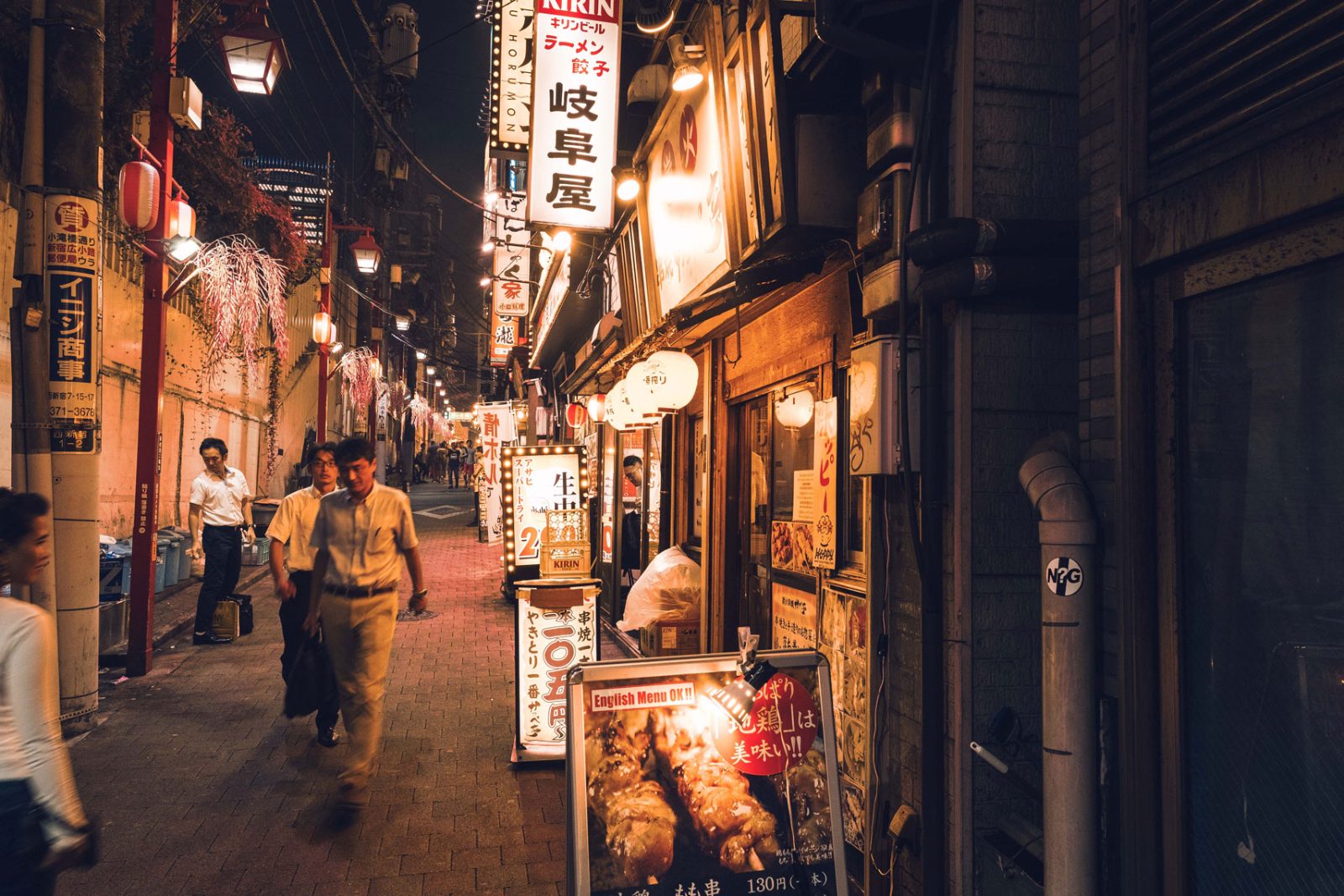 People in a lantern-lit alley — understanding happens where life happens