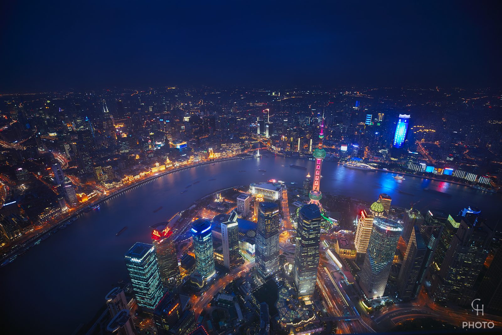 A city seen whole from above at night — a system that knows its world